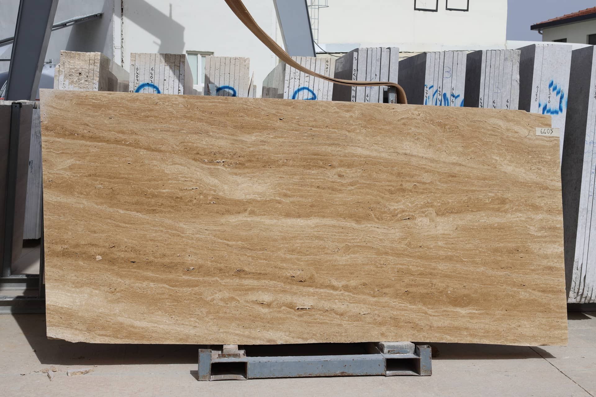 Warm Walnut Vein Cut polished travertine slab in Brown